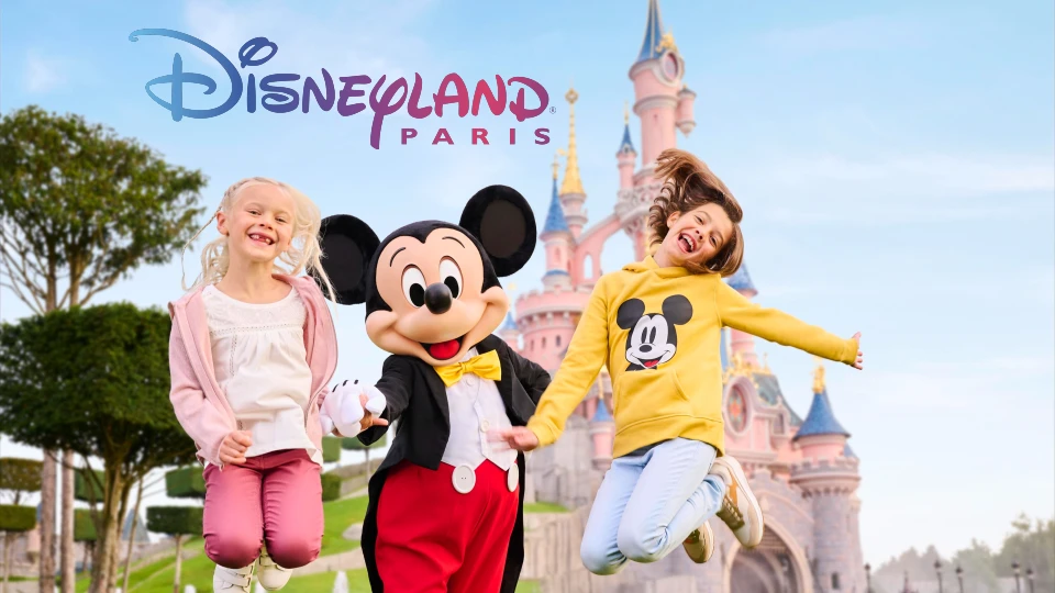 Kids jumping in front of Disneyland Paris castle
